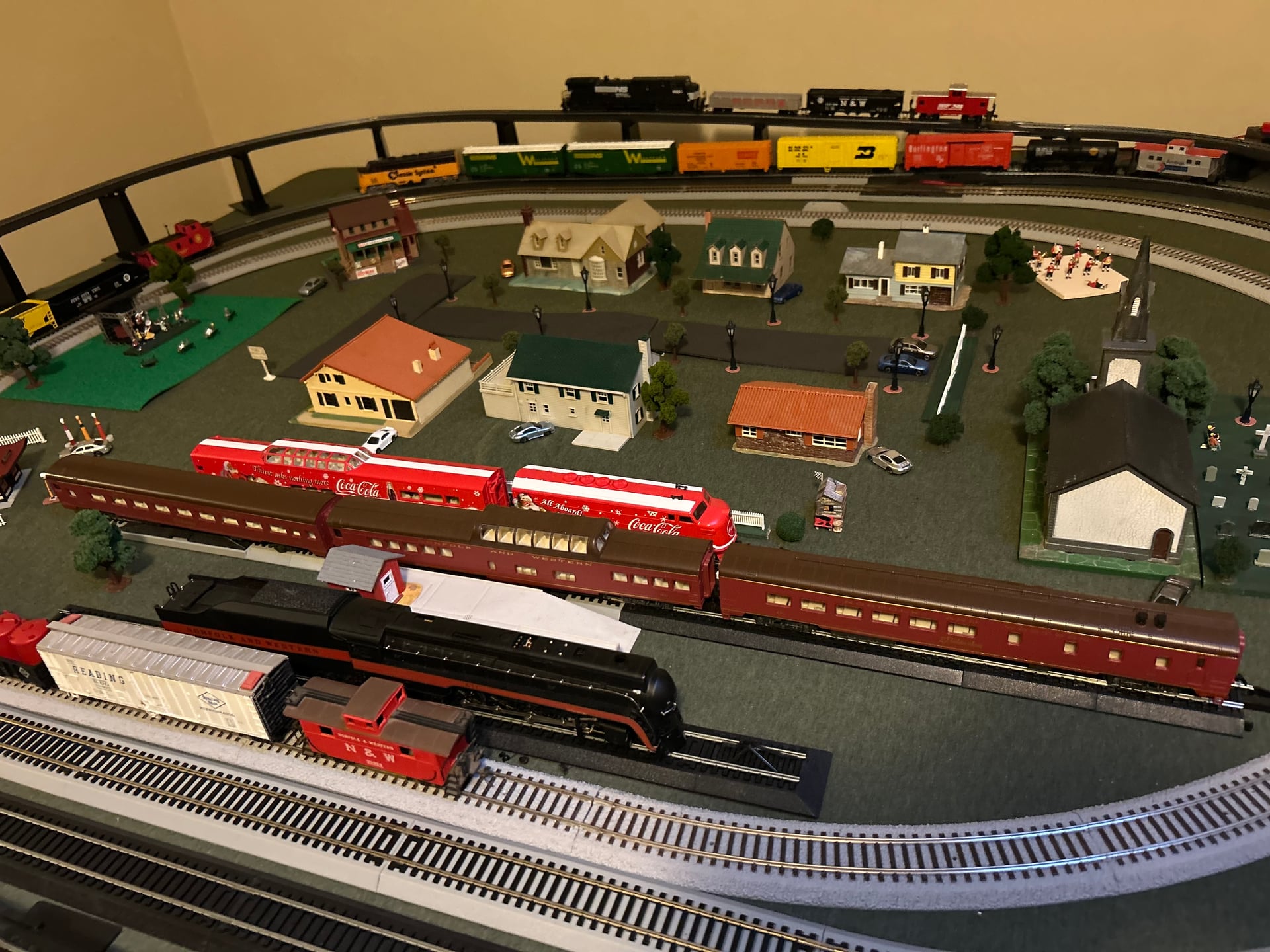 Charlie's model train layout, a multi-level setup with a little town, a church, and Norfolk & Western cars